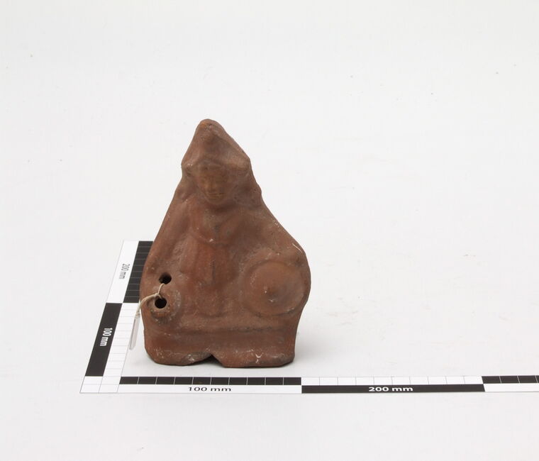 Öllampe in Form einer Figur aus Ton